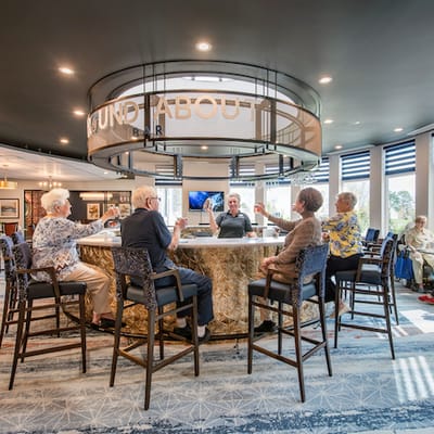 Residents enjoying drinks at a social gathering in a common area