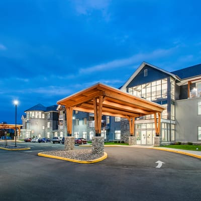 Exterior view of the Meadowcrest facility entrance at dusk