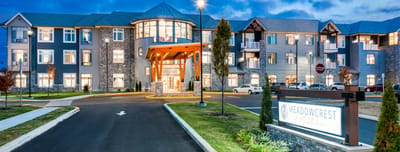 Exterior view of the Meadowcrest facility at dusk