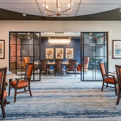 Bright interior common area with dining tables