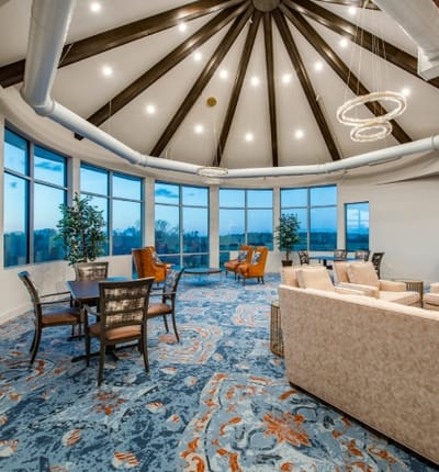 Bright common area with comfortable seating and large windows