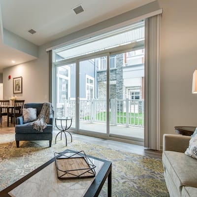 Interior view of a cozy common area with access to outdoor space