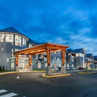 Exterior view of Meadowcrest facility entrance at dusk