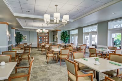 Bright dining room with tables and chairs