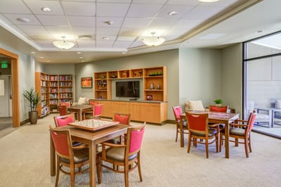 Interior common area with tables and bookshelves