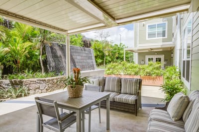 Outdoor seating area with plants and a table