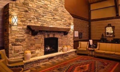 Cozy common area with a stone fireplace
