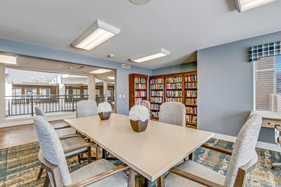 Bright common area with books and tables