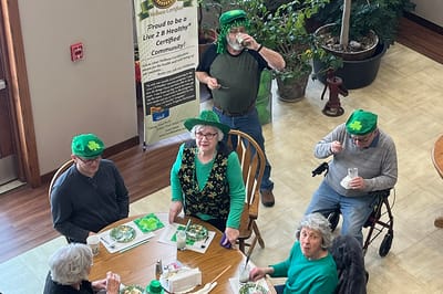 Residents enjoying a festive St. Patrick's Day meal