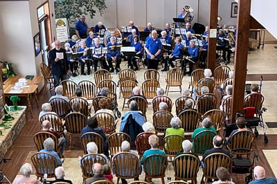 Residents enjoying a live music performance indoors.