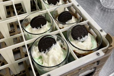 Desserts in individual cups with Oreos on top