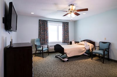 Private resident room with bed and seating area