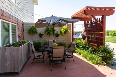 Outdoor patio area with seating and planters.