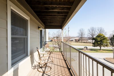 Balcony with rocking chairs and outdoor view