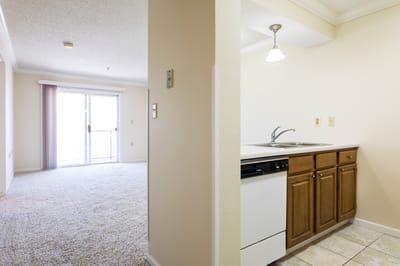 Interior view of a resident room and kitchenette.