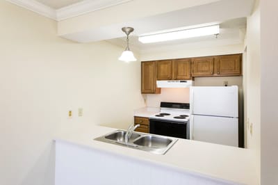Interior view of a kitchen in a living space.