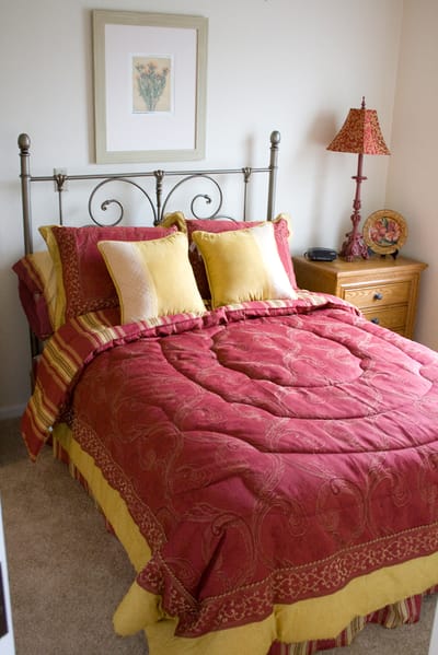 Cozy bedroom with decorative bedding
