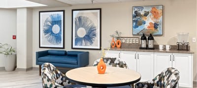 Bright common area with seating and artwork