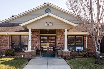 Exterior view of a nursing home entrance.