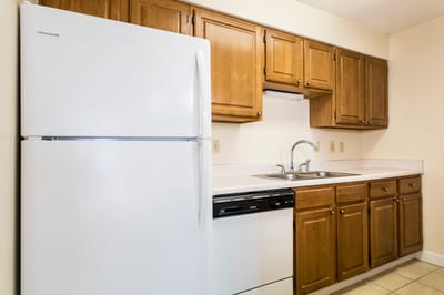 Clean kitchen interior with wooden cabinets.