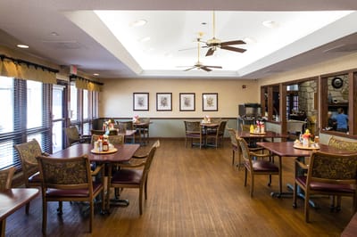Dining area with tables and decorations.