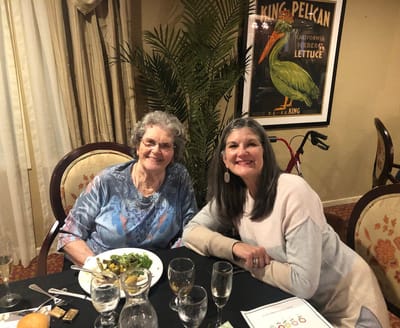 Two women enjoying a meal in the dining area.