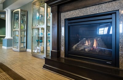 Interior view of a cozy common area with fireplace.