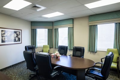 Conference room with seating and floral decor