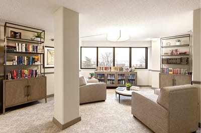 Cozy common area with bookshelves and seating