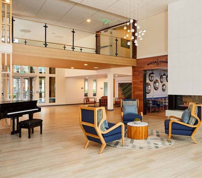 Modern common area with seating and piano
