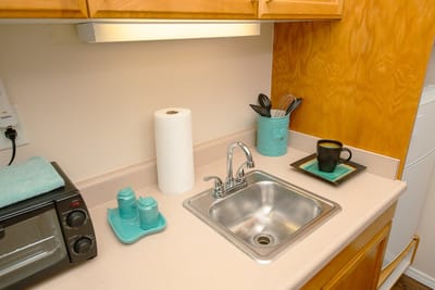 Cozy kitchenette with sink and coffee