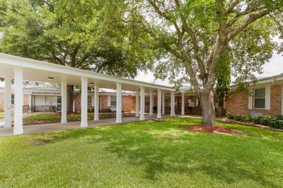 Exterior view of the healthcare facility with green lawn