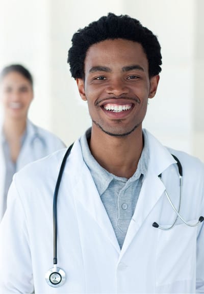 Healthcare worker smiling in a facility setting
