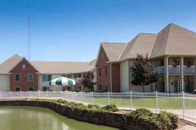 Exterior view of Mount Alverna Village with landscaping.