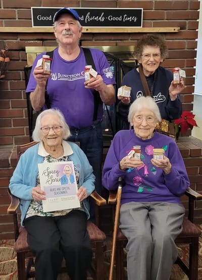 Residents participating in a fun activity with jars.