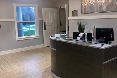 Reception area with modern decor and natural light.