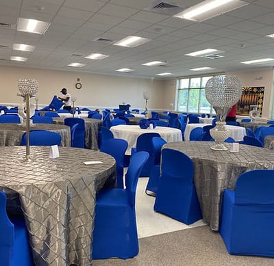 Decorated event space with tables and chairs