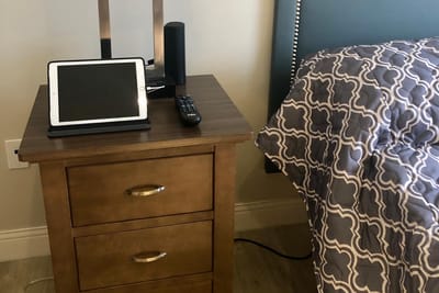 Cozy bedside setup with tablet and radio