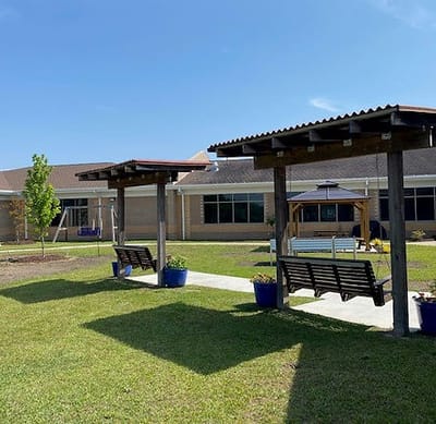 Outdoor seating area with shaded benches