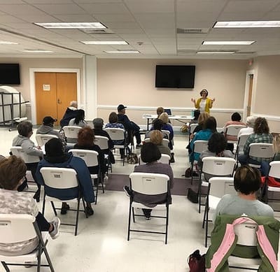 Residents engaged in a group activity during a meeting.