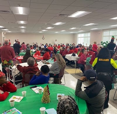 Residents and staff celebrating together at an event.