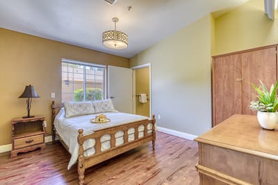 Bright private room with a comfortable bed and decor