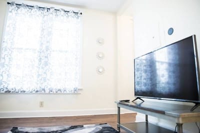 Cozy interior with a television and decorative curtains