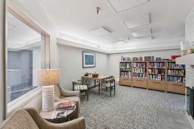 Cozy common area with bookshelves and seating