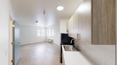 Spacious interior of a resident room with kitchen