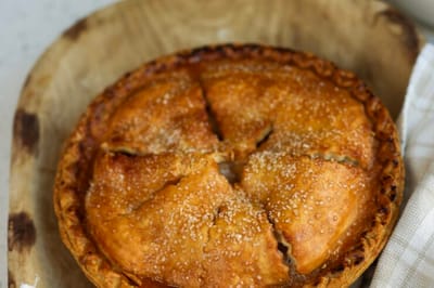 Freshly baked pie in a wooden bowl