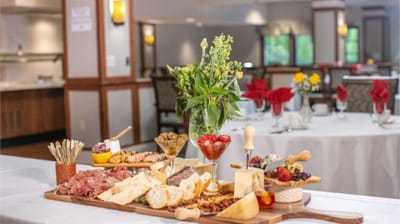 A beautifully arranged charcuterie board in a dining area.