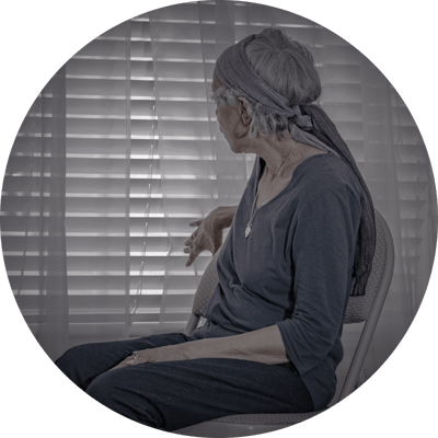 Senior woman seated near window