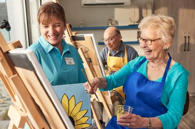 Residents engaging in a painting activity.