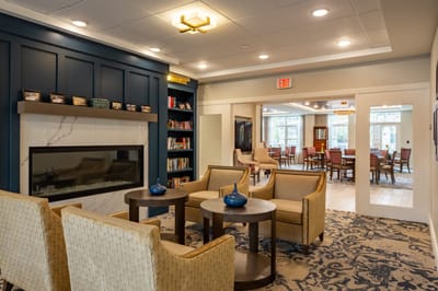 Well-designed common area with seating and a fireplace.